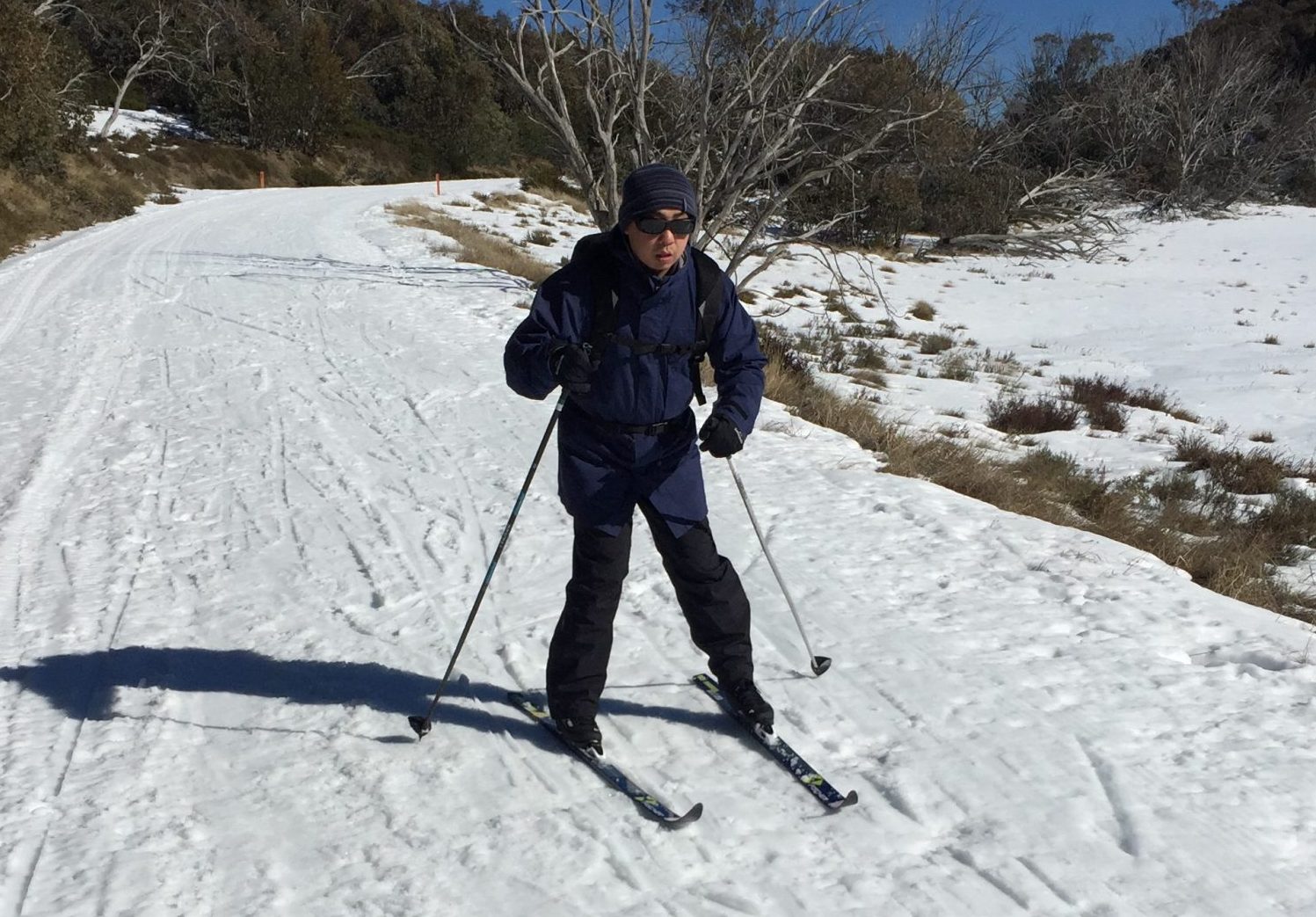Out Doors Inc participant, Gary Wong, skiing on a program